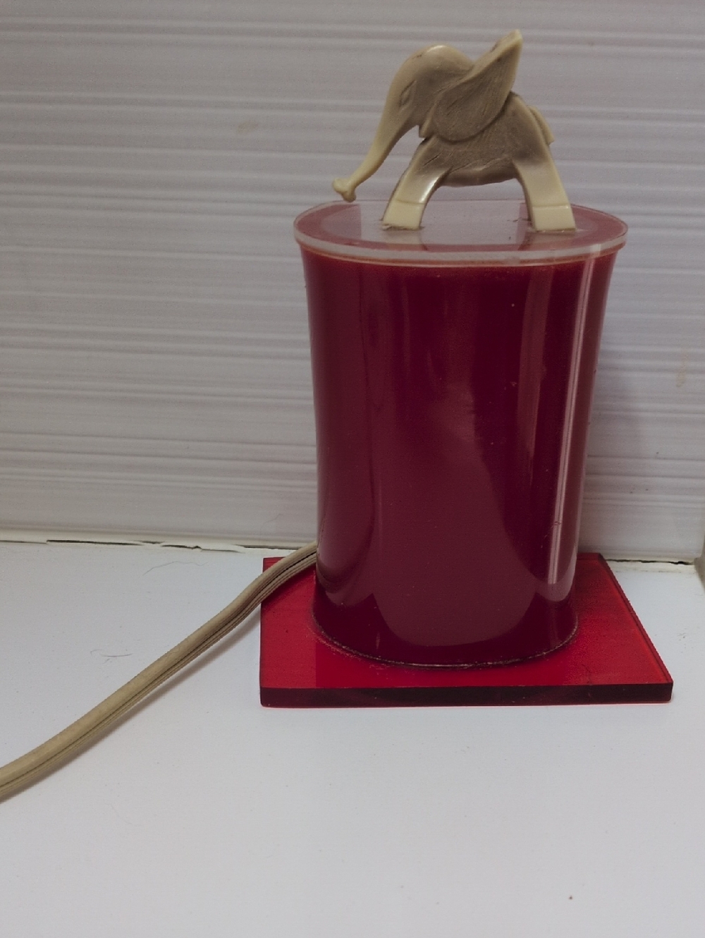 Vintage Red Bakelite Light With Elephant On Top.